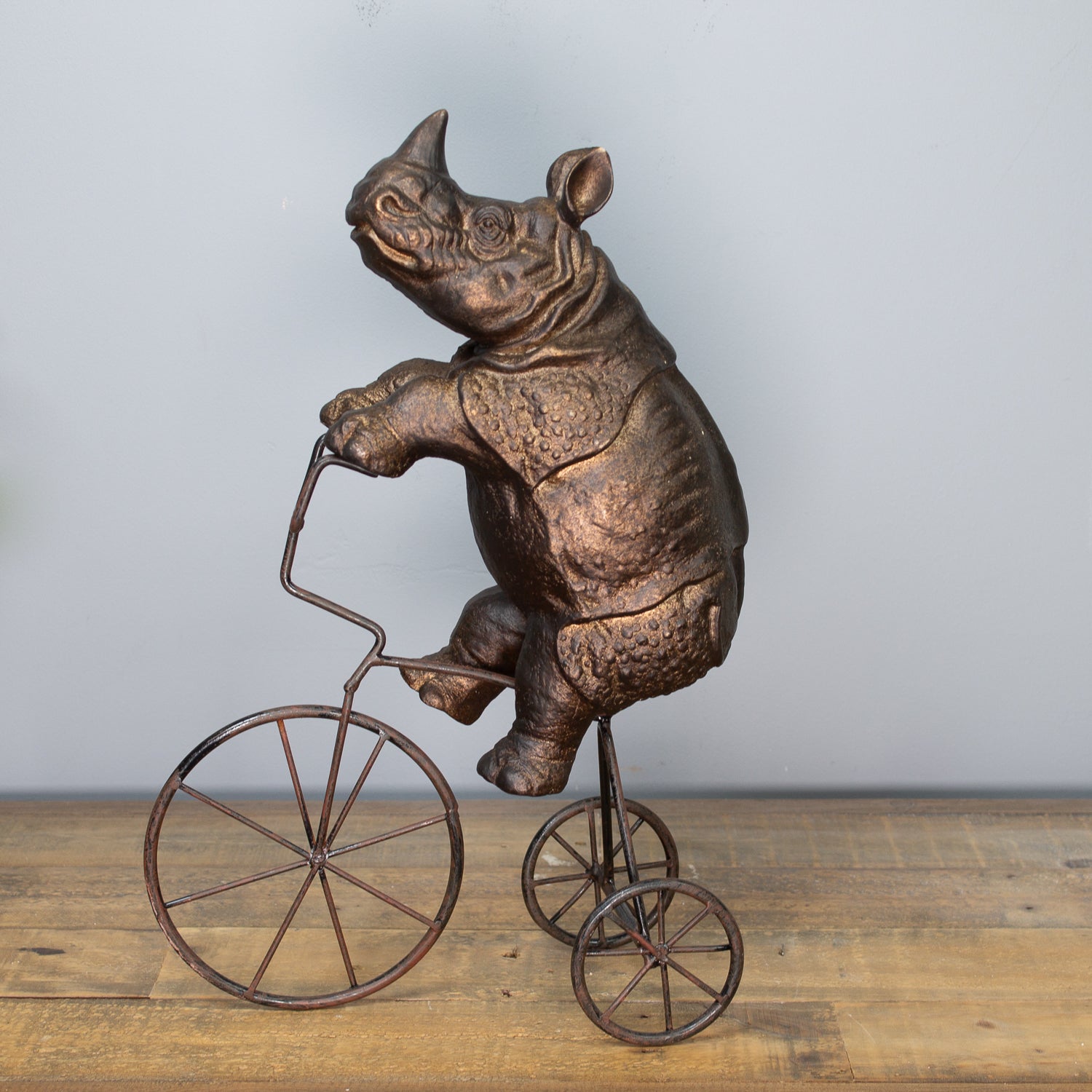 Rhino On Tricycle Sculpture