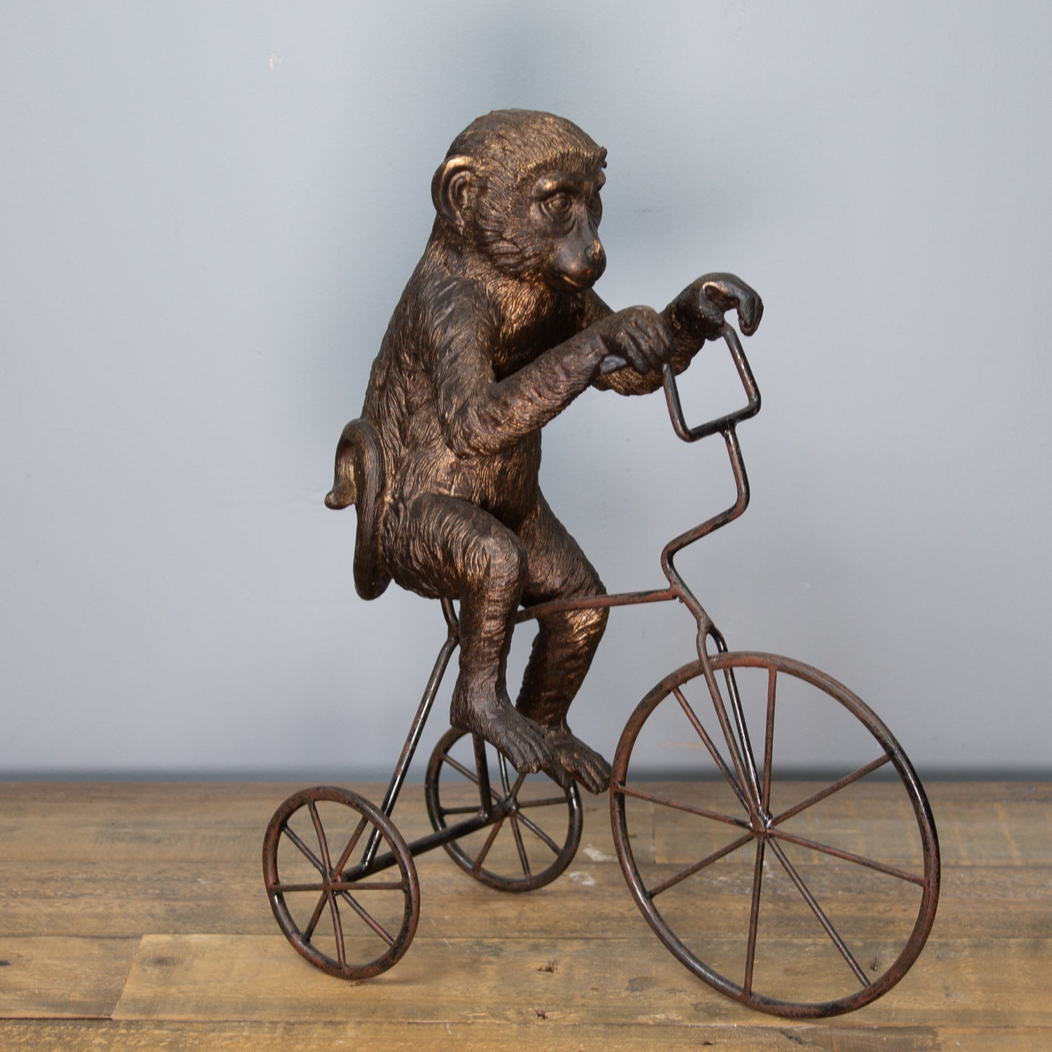 Monkey On Tricycle Sculpture
